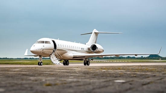 Private jet on a landing strip.
