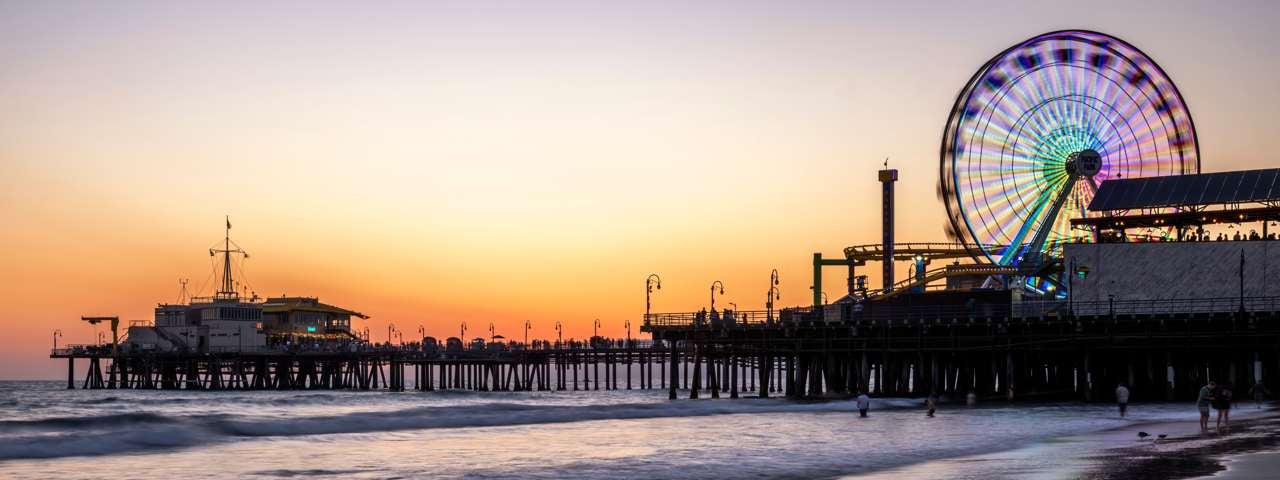 The pier on Venice Beach lit up in the sunset