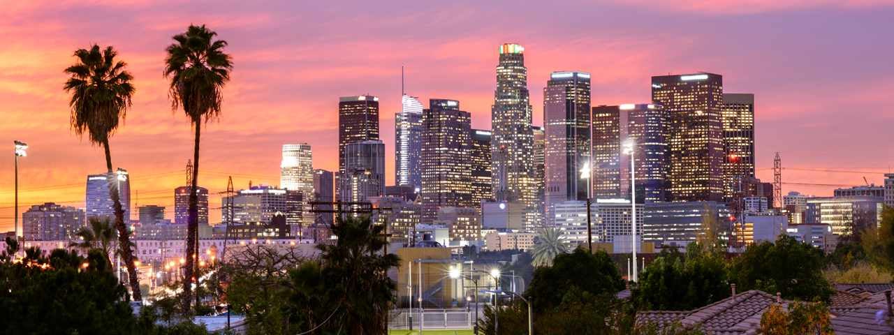 Skyline of Downtown LA with the sunset in the background